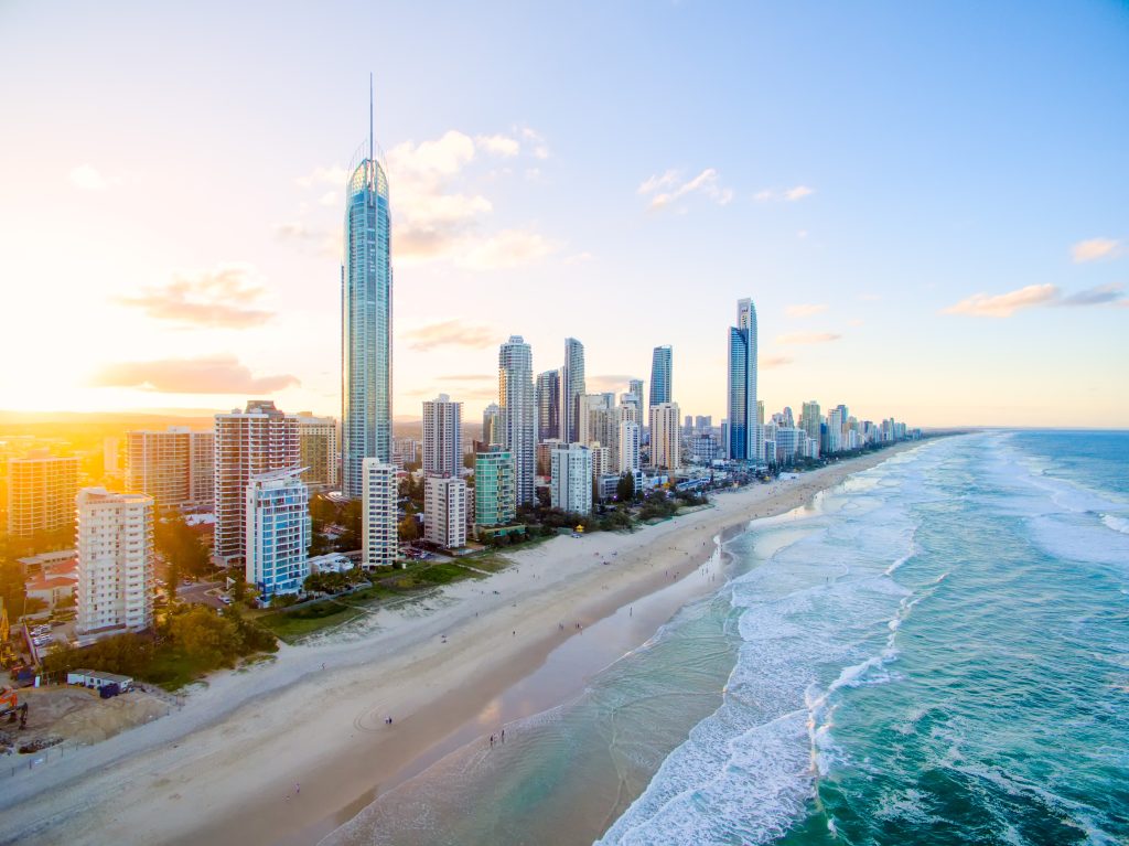 Skyline of the Gold Coast with the empty sandy beach in front.